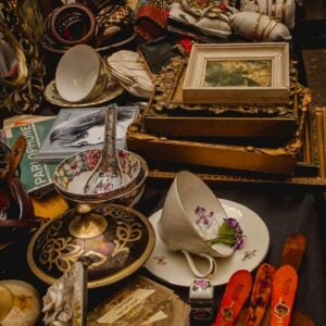 An eclectic collection of antique trinkets and vintage decor at a flea market stall.