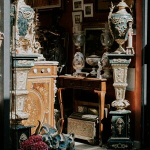 Explore a quaint antique shop showcasing ornate vases and vintage decor in a cozy setting.